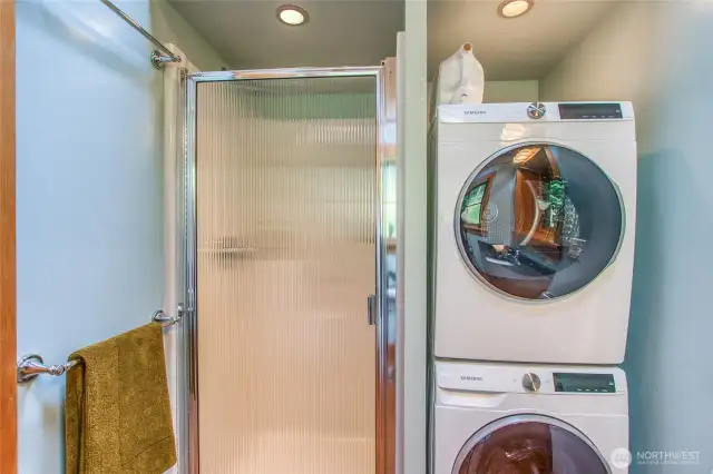The washer/dryer and hot water heater are contained in the bathroom.