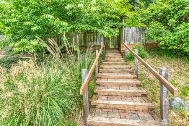 Stairs connect the home to the parking area.