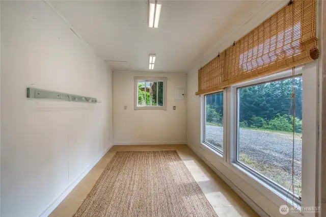 The finished studio attached to the carport can be used as an ofice or flex space as needed.