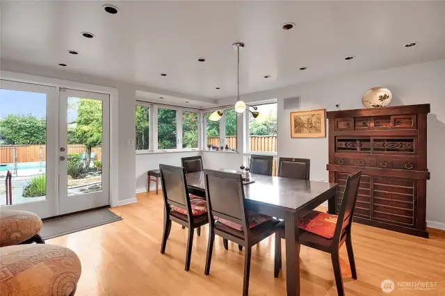 Wrap-around windows overlook the back yard.