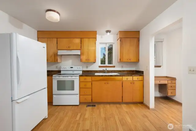 Highly efficient kitchen space. The trim at the top of the cabinets is a nice feature.