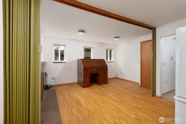 This partition is right by the kitchen and can easily be closed off to create a separate space. You could use this space as a dining room, or close the partition and use it as another bedroom!