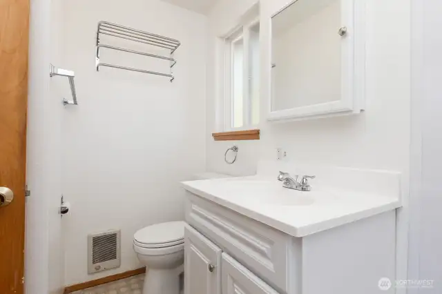 Freshly painted, efficient bathroom.