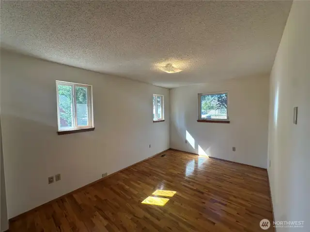 Notice the beautiful hardwood floors in the primary bedroom. It was protected by carpet that has since been pulled up!