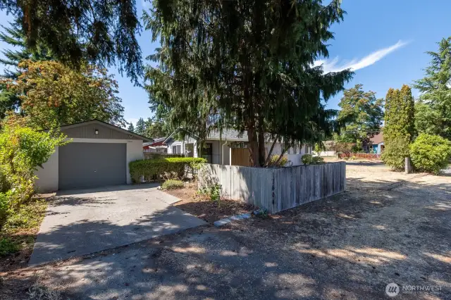 This is standing at the southeast corner of the lot showing the huge lot space! Mature trees help provide plenty of shade.