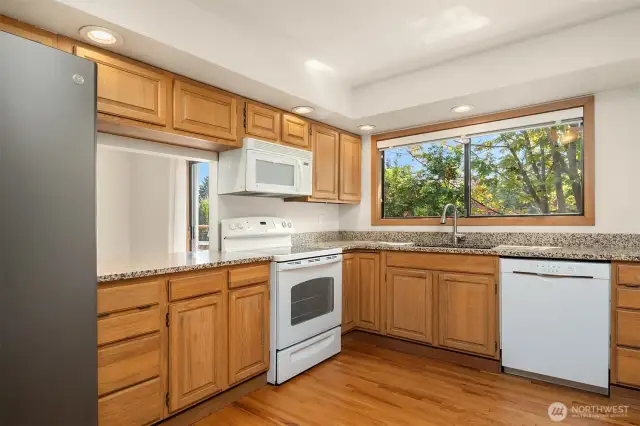 Kitchen pass-thru and seating.