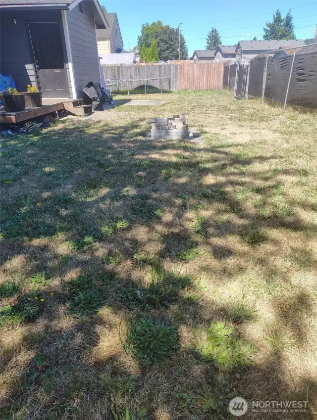 Back yard area with driveway off of the alley.  Room to park