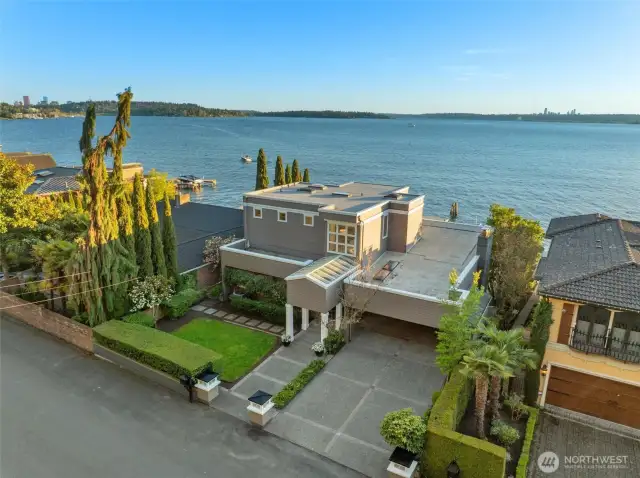 Timeless 3-bed, 3-bath escape where classic charm and lakeside luxury converge - boasting 60 feet of prime, southwest-facing shoreline built to be cherished for generations.