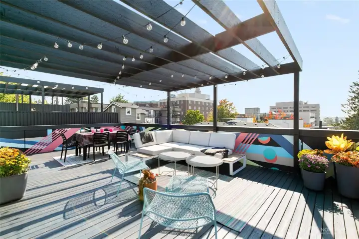 Built in pergola provides an intimate setting, and delightful shade. Gas hook ups on the roof allow for easy cooking!
