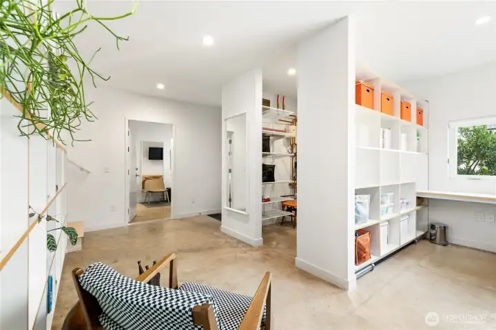 A versatile first floor and entryway - storage, office space, bike storage!