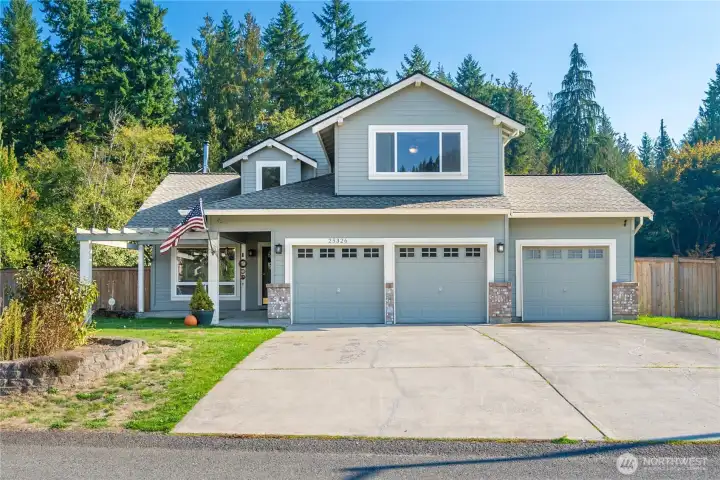 Welcome Home! Charming 4 Bedroom home on large lot with 3 car attached garage.