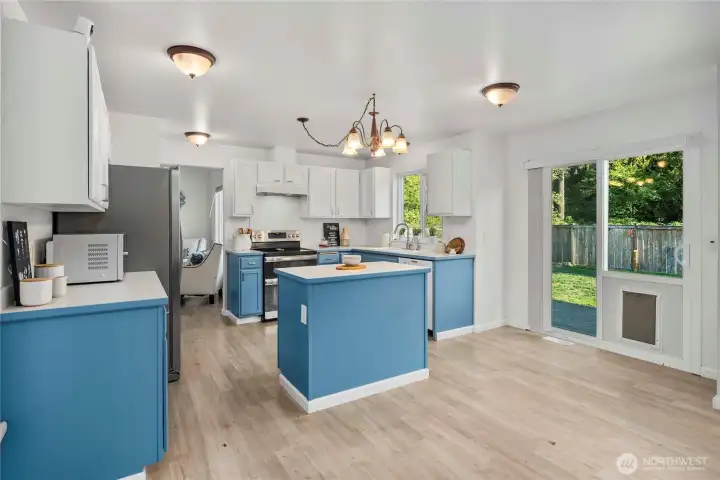 Convenient slider off the kitchen with a doggy door to the secure fenced yard