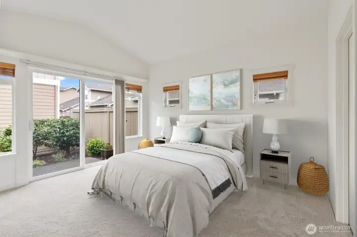 Spacious primary suite with vaulted ceilings.