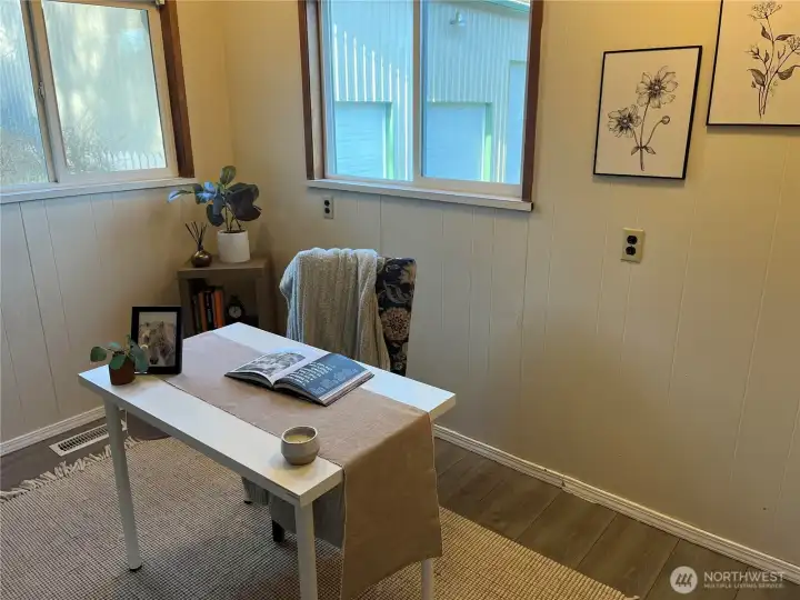 Office w half bath or extra bedroom behind Garage separate door on side towards shop