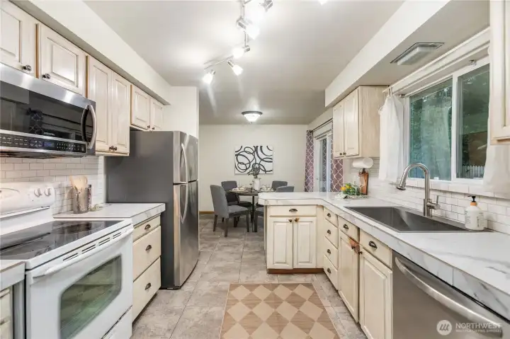 Kitchen towards dining room new refer and dishwasher