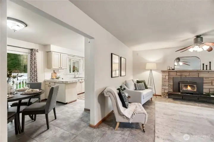 Living Room with fireplace and wood stove and dining room