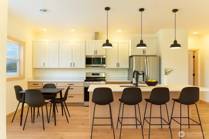 Bright natural light, fresh clean lines, and large island. Virtually staged.