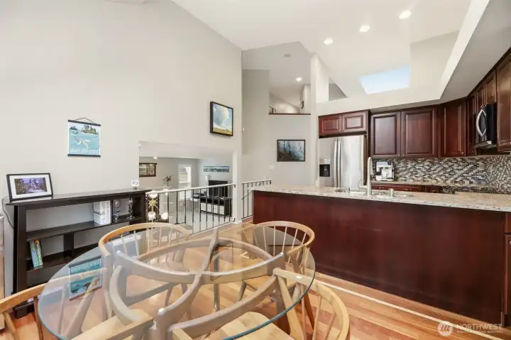 Kitchen offers room for casual dining with skylight above providing natual light