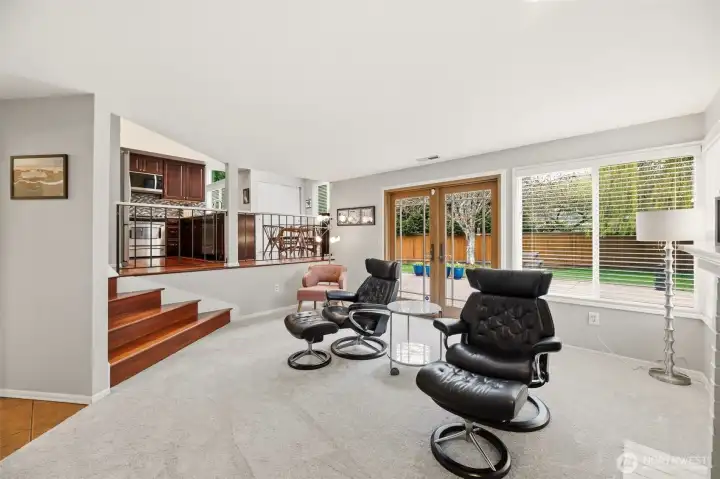 Lower level features gas fireplace and fFench doors to outside patio