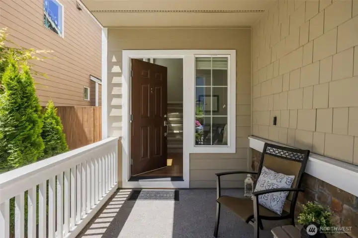 Covered Porch for entry for sitting and relaxing while kids are playing in the park
