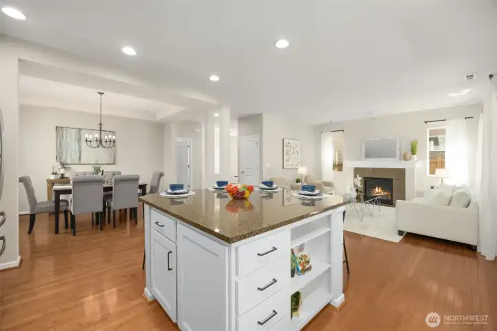 The chef’s kitchen featuring granite countertops, full_height backsplash, designer cabinetry with glass inserts and under cabinet lighting.