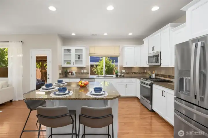 Soaring 9_ft ceilings and expansive windows provides natural light for the main floor