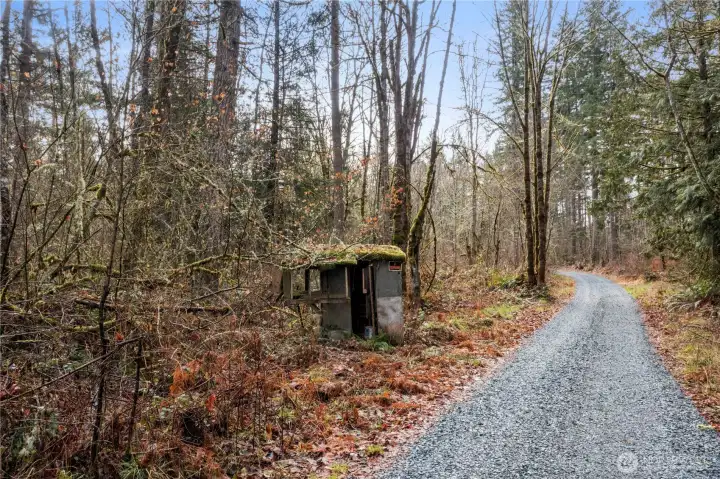 Looking at the Northwest corner of the property, the road turns left then goes on a slight incline the the level 3 acres which would be the building site.