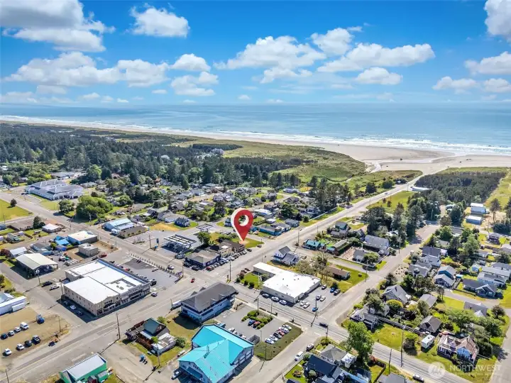 Wide aerial perspective highlighting the property's strategic location within one of the Peninsula's most established commercial districts.
