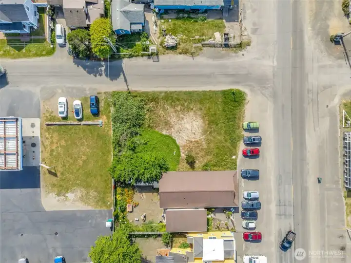 Bird's-eye view showcasing the lot's corner location, level topography, and convenient access from surrounding streets.