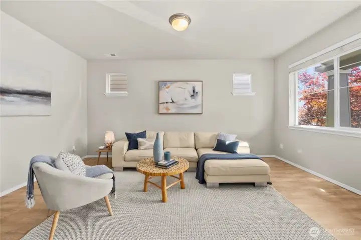 Bright and airy feel created by oversized front window and smaller side wall windows