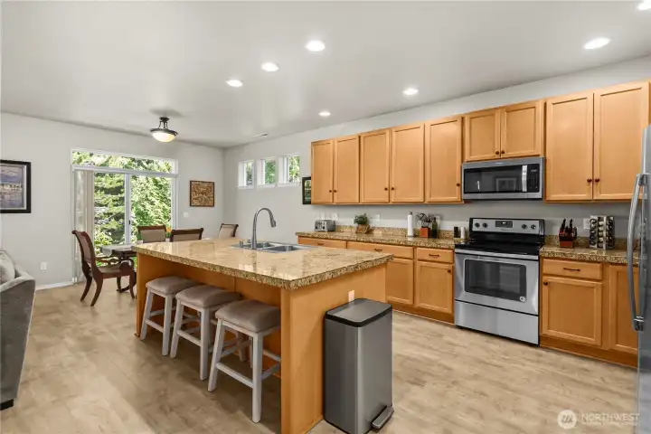 Kitchen featuring abundant cabinet and counter space with a large center island
