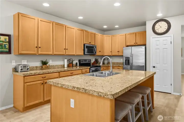Well-designed kitchen with extensive prep areas and plenty of storage throughout