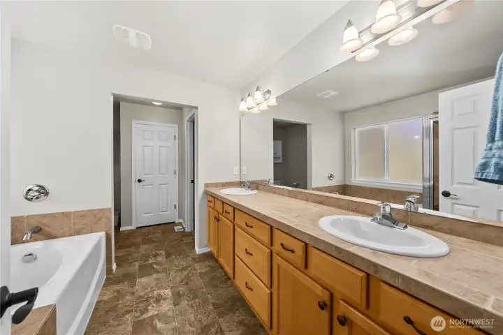 Luxurious 5-piece primary bathroom with dual vanities