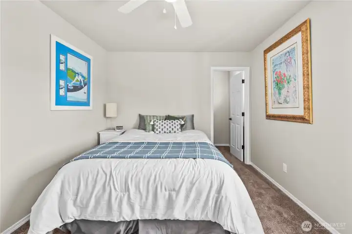 Different view of the upper-level bedroom revealing its thoughtful design and flow