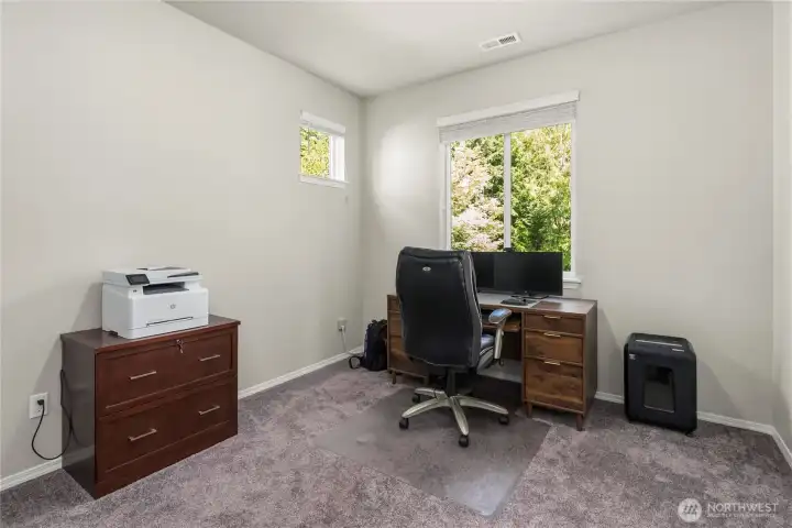 Versatile upper-level bedroom being used as an office space