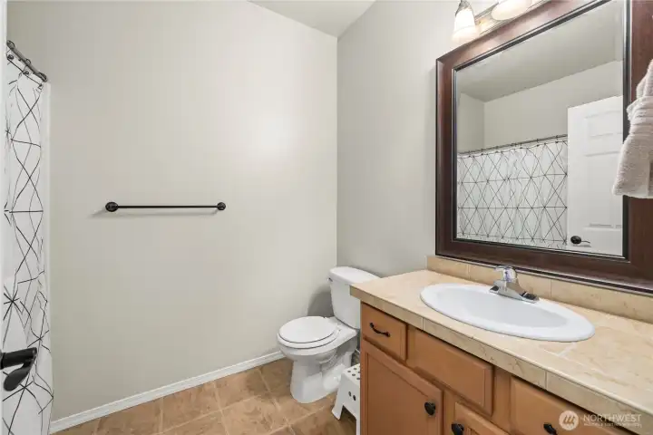 Conveniently located guest bathroom for easy access and everyday use
