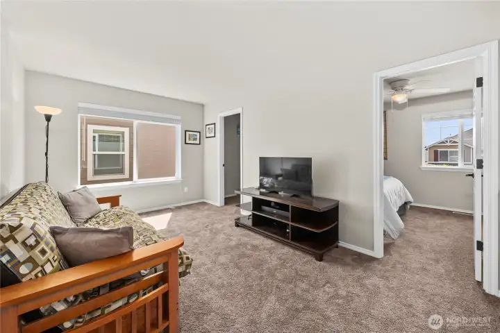 Versatile upstairs flex space ideal for work, play, or relaxation