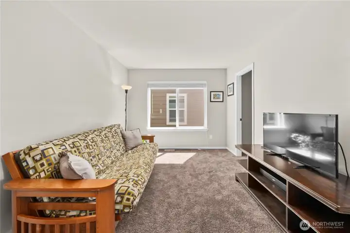 Large window provides additional natural light, enhancing the brightness of the space
