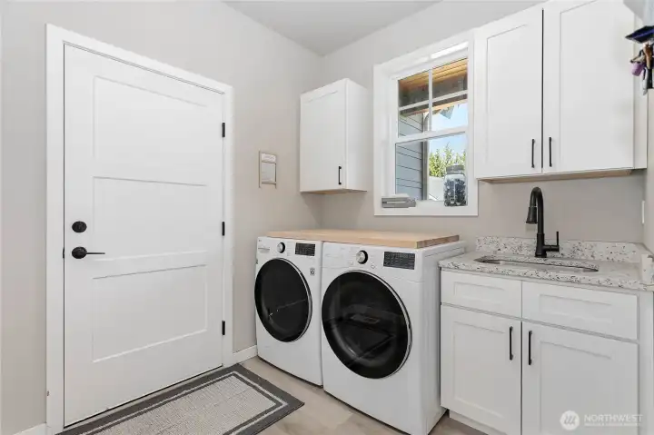 Laundry with lot of storage and utility sink