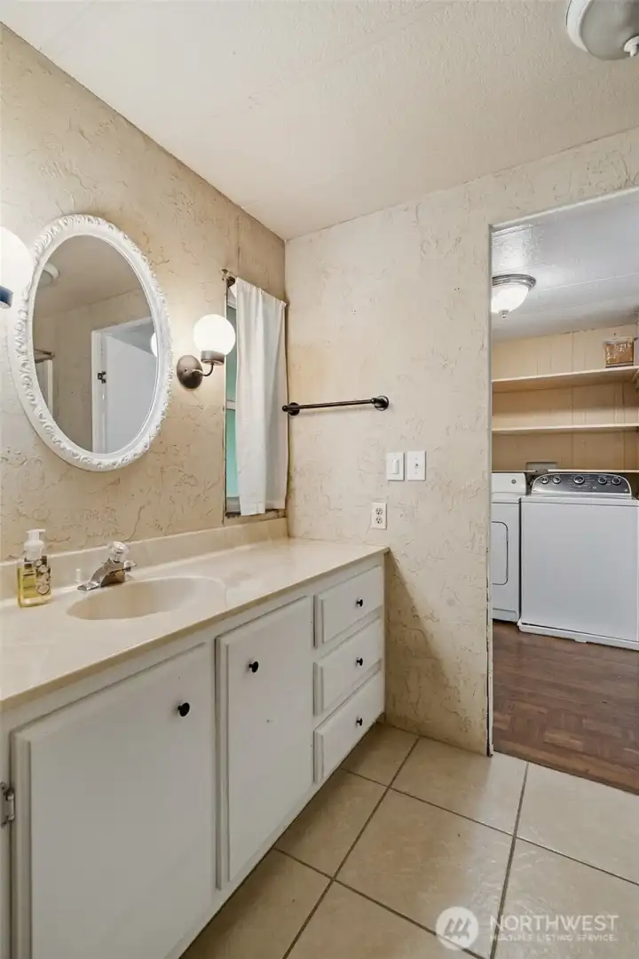 Full bathroom connected to bedroom 2 and the main lving area