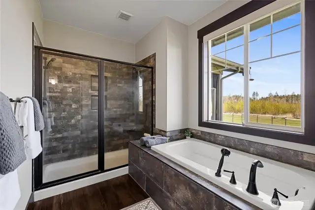 Soak away the stress in the oversized tub or refresh in the expansive walk-in shower.