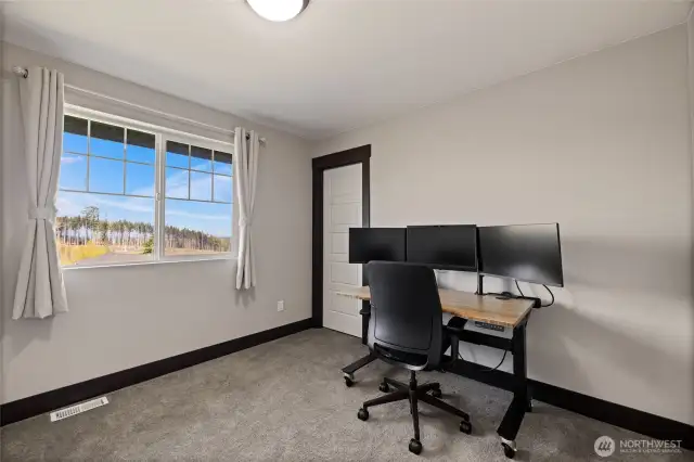 Second upstairs bedroom with generous proportions and natural light.