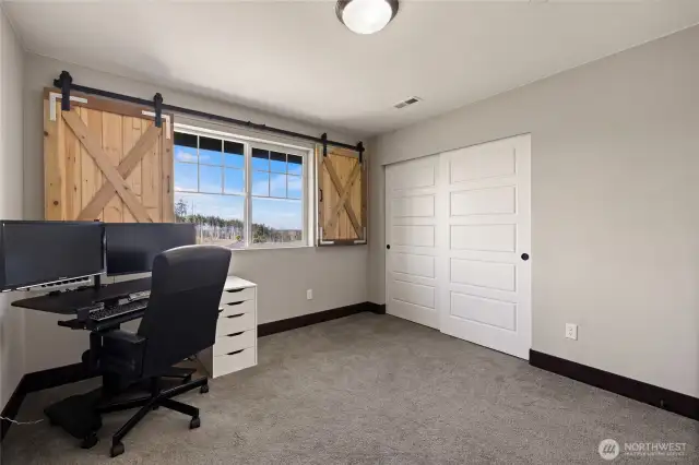 Third upstairs bedroom—spacious, inviting, and filled with light.