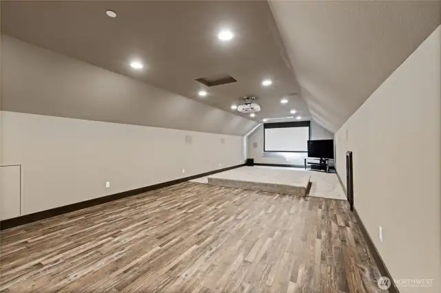 Massive upstairs entertainment area—ideal for a theatre, game room, or both!