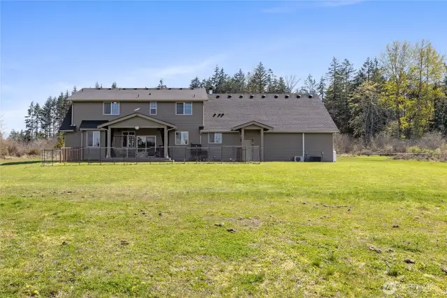 Back view of the custom home—showcasing its size and beauty.