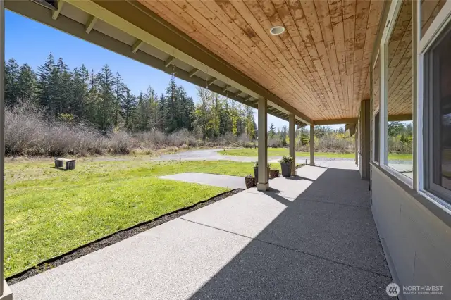 The long front porch provides plenty of space to sit, relax, and enjoy peaceful surroundings.