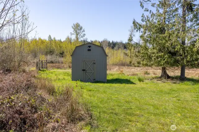 Additional backyard shed for tools and gardening supplies.