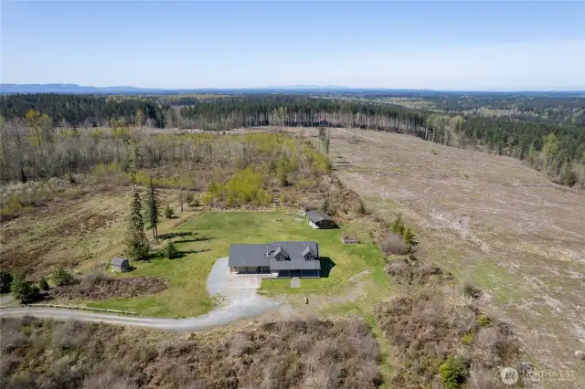 Peaceful forested views and open space surround the home—your private escape.