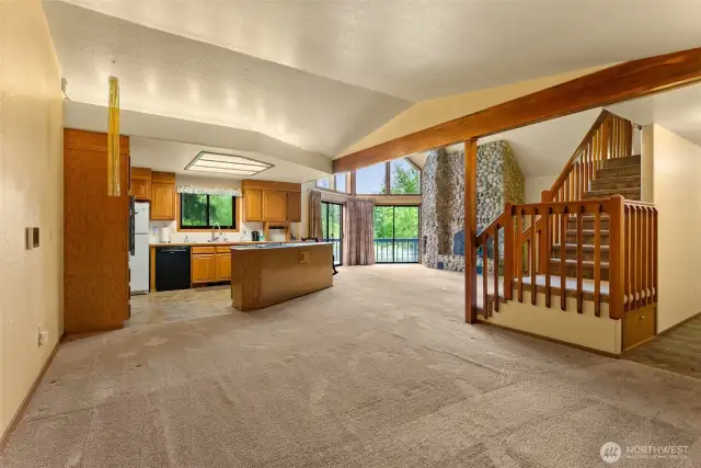 This is the dining area with an open-concept kitchen behind.