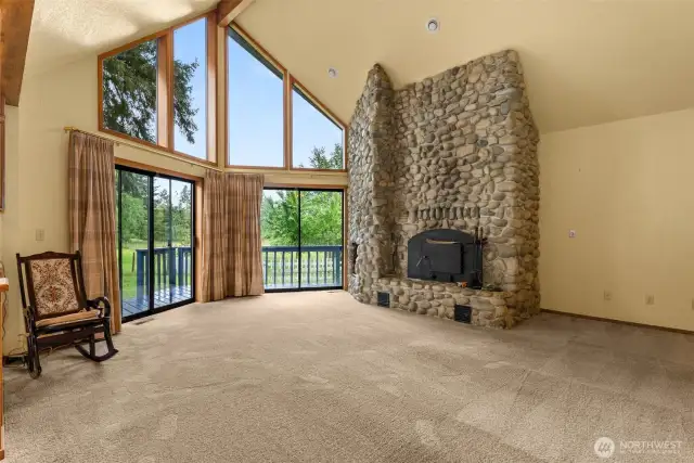 Custom rock fireplace in the great room next to a peaceful vista.
